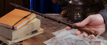 A wooden magic wand in brown with delicate carvings