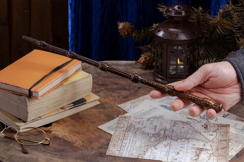 A wooden magic wand in brown with delicate carvings